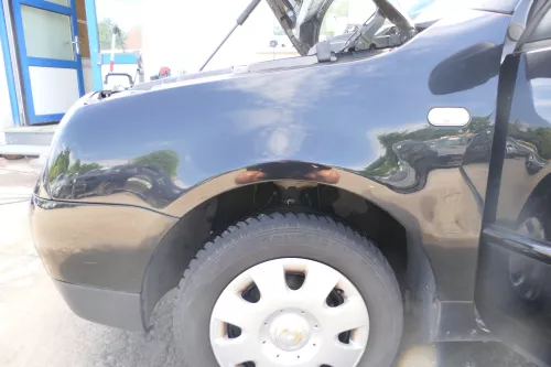 VW Lupo Kotflügel vorne links schwarz L041 vorn - eine kleine Delle